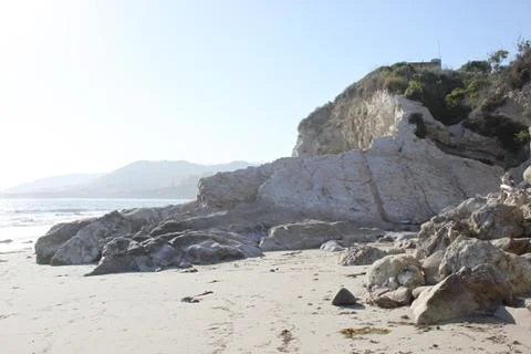Rock Formation On A Sandy Beach Stock Photos