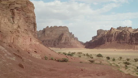 Rock formation with sun and clouds. AlUla, Saudi Arabia. Aerial 4K. Stock Footage 196823880