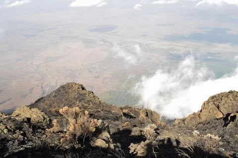 Rock formations above the clouds at Mount Meru, Tanzania Stock Photos