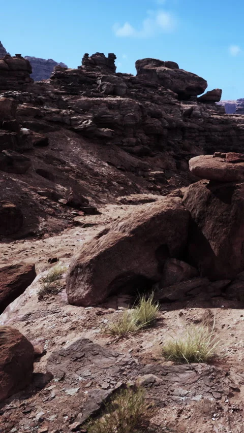 Rock formations and dry terrain in a desert landscape during daytime Stock Footage 337996812