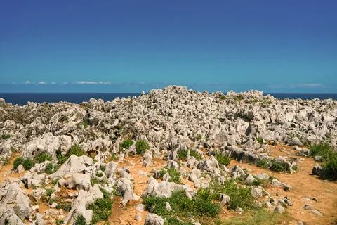 Rock formations and pebbles. Wave texture, a rock formation in the sea Stock Photos