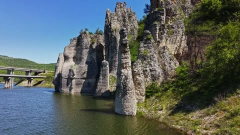 Rock formations and water under clear skies in a rural area Stock Footage 338276221