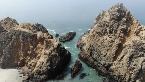Rock Formations at Beach Getting Hit By Waves in Slow Motion Stock Footage 142317824