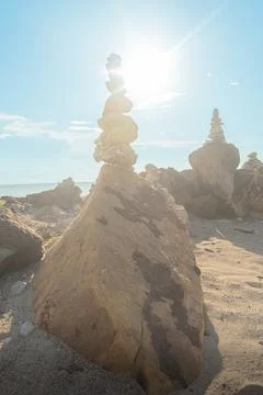 Rock formations on the beach at sunset Foto stock