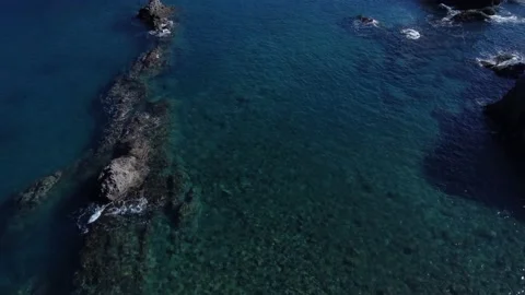Rock Formations in Blue Waters Stock Footage 229130486