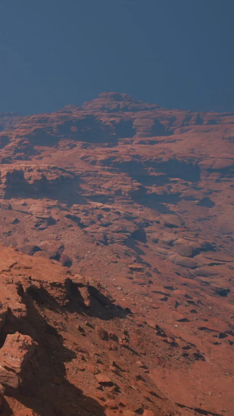 Rock formations cover the ground in rich tones of rust and red Stock Footage 342178626