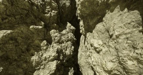 Rock formations create intricate patterns in a remote canyon at midday Stock Illustration