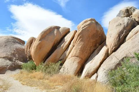 Rock Formations Dance Under the Blue Sky at Joshua Tree National Park Stock Photos