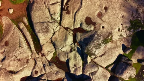 Rock formations display textures and patterns in a sunny outdoor location during Stock Footage 335400609