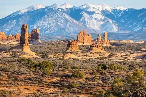 Rock formations with distant snow-covered mountains in the distance 写真素材