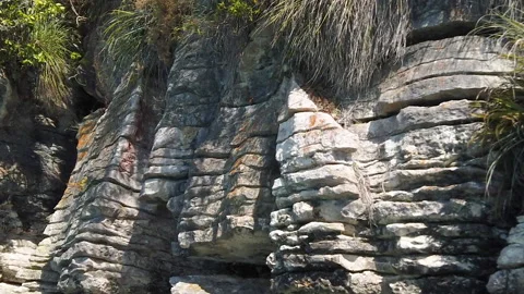 Rock formations know as the Pancake Rocks at the town of Raglan,New Zealand Stock Footage 142278107