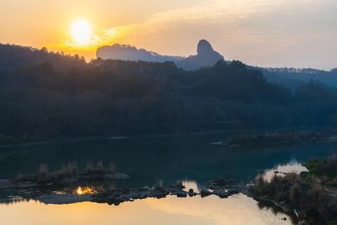 Rock formations lining the nine bend river or Jiuxi in Wuyishan Stock Photos