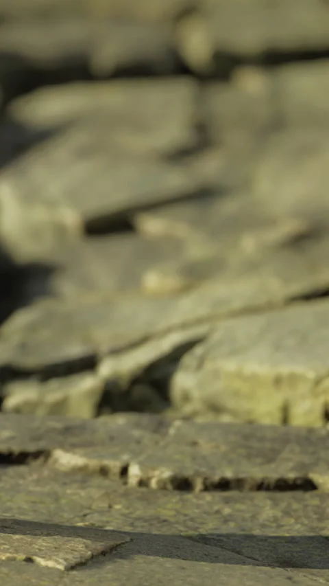 Rock formations near water during daytime in a natural setting with sun Stock Footage 335965361