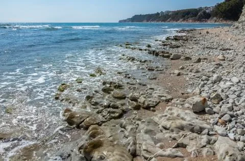 Rock formations north of the beach Stock Photos