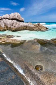 Rock formations at the remote beach Anse Aux Cedres, La Digue, Seychelles Stock Photos