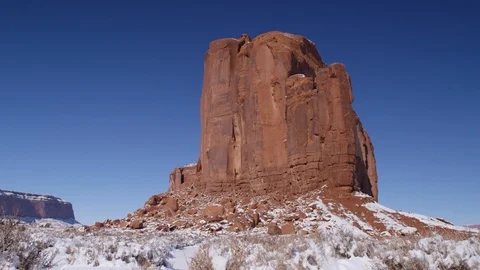 Rock formations surrounded with snow in Monument Valley area Stock Footage 104113572