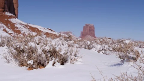 Rock formations surrounded with snow in Monument Valley area Stock Footage 104113596
