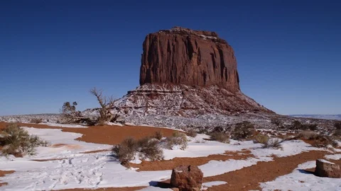 Rock formations surrounded with snow in Monument Valley area Stock Footage 104113628