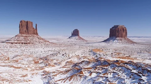 Rock formations surrounded with snow in Monument Valley area Stock Footage 104113686