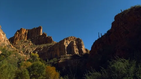 Rock formations surrounded by trees and bushes. Stock Footage 88406540
