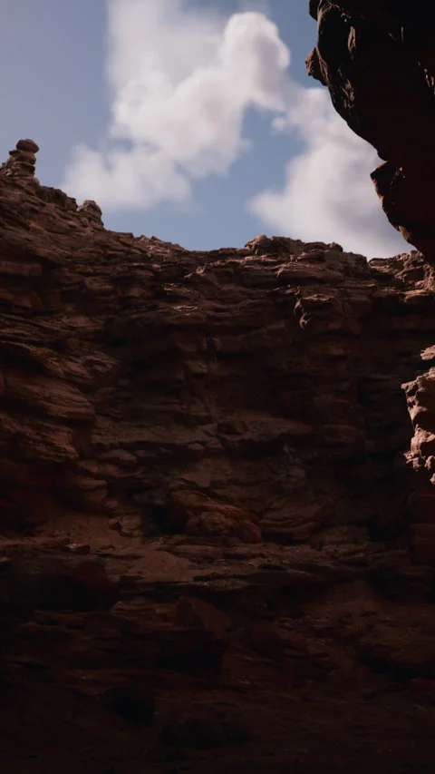 Rock formations under a cloudy sky in a canyon setting Stock Footage 346754862