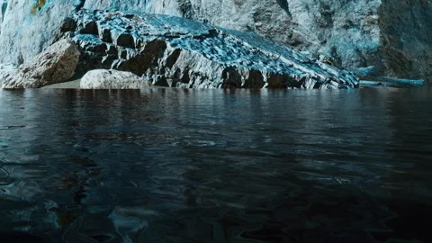 Rock formations by water in a natural setting during the day Stock Footage 339873821