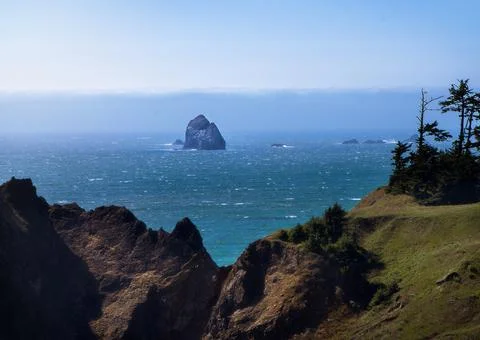 Rock framed between cliffside of the Oregon Coast by hwy 101 Stock Photos