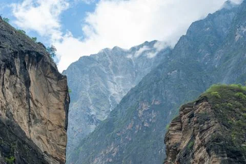 Rock in front of a mountain range under blue clouded sky, hike (2 day tour) to Stock Photos
