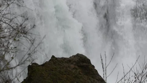 Rock in front of waterfall Stock Footage 297971013