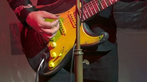 Rock guitar played under strobe light 스톡 동영상 77969277