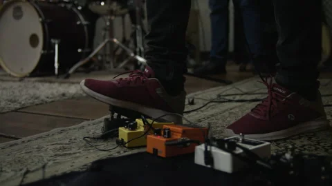 Rock guitar player using pedals close up feet Stock Footage 241931427