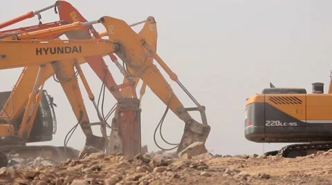 Rock hammer breakers in the construction site Stock Footage 61770032