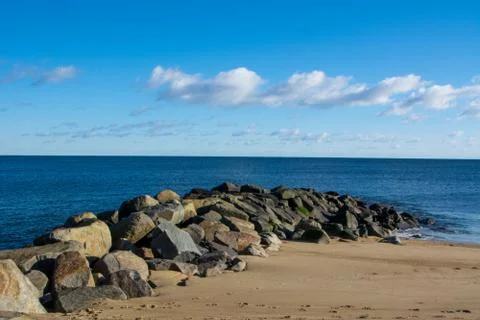 Rock Jetty on Beach Stock Photos