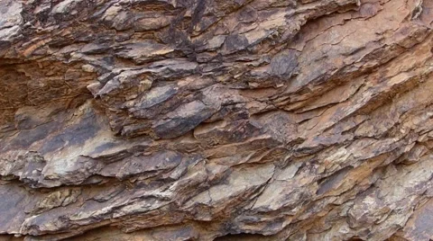 Rock layers, hand breaking brittle rock Stock Footage 41474247