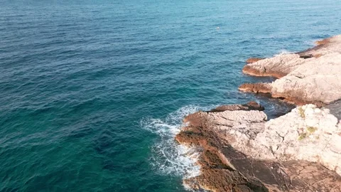 Rock in the middle of the sea Stock Footage 249695937