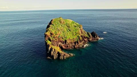 A rock in the middle of the sea Stock Photos