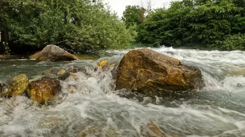 Rock in the middle of the stream Stock Footage 283410148