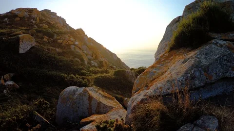 ROCK MOUNTAIN WITH SUNSET IN THE SEA Stock Footage 94230424