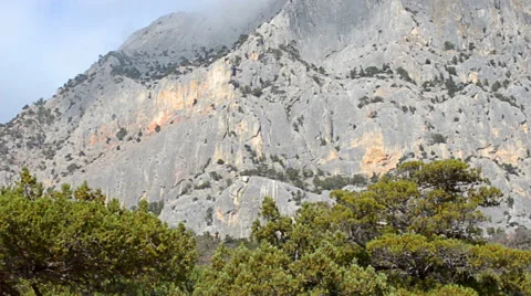 Rock mountain with top in cumulus cloud Stock-Footage 44495800