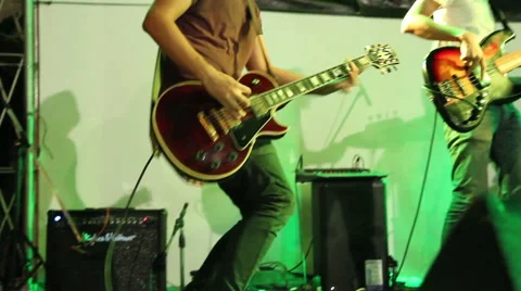 Rock musician playing solo Gibson electric guitar, Rock band at live concert Stock Footage