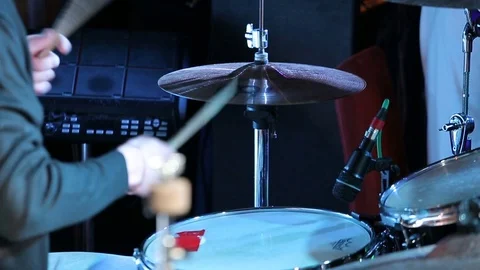 Rock n roll drummer plays music on concert Stock Footage 80077556