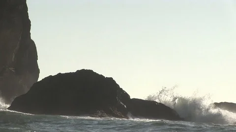 Rock in Ocean Being Crashed with Waves Stock Footage 119892755