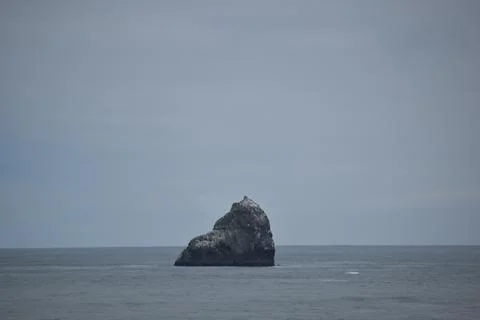 Rock in the Ocean waves Stock Photos