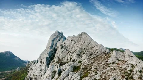 Rock Peak. Mountain range. A green plateau, sheltered from drought. Drone aerial Stock Footage 220633077