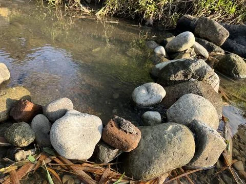 Rock pebble on the side of a river Foto stock