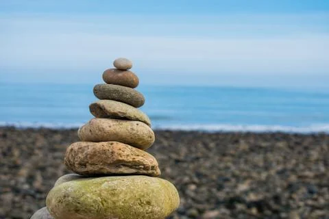 A rock pile or stack, with a blue sky as a background 库存照片