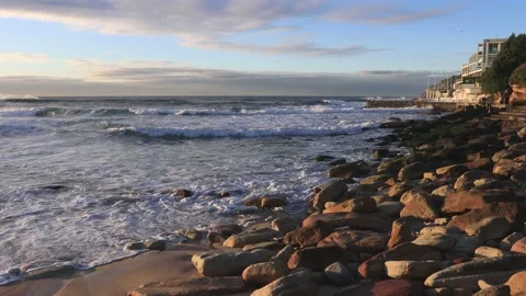 Rock pool and local cafe at Bondi beach of Sydney – sunrise in 4k. Stock Footage 136347313