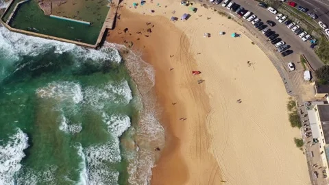 Rock pool on Curl Curl sandy beach on Sydney Northern beaches aerial 4k. Stock Footage 170673298