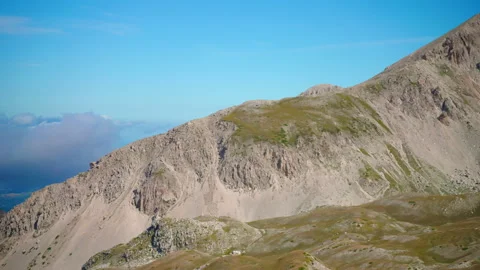 Rock range mountains against blue sky background, panoramic view of mountains Stock Footage 224776847