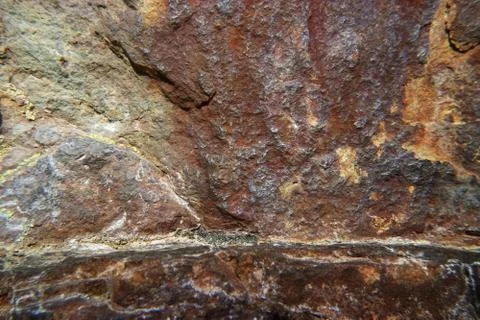 Rock red stone at close range as background for design. Stock Photos